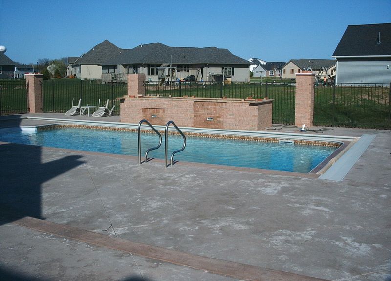 Landscaping and in-ground pool installed by Spring's Pools and Spas